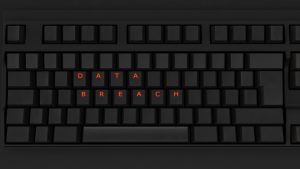 Close Up of Illuminated Glowing Keys on a Black Keyboard Spelling Data Breach 3d illustration